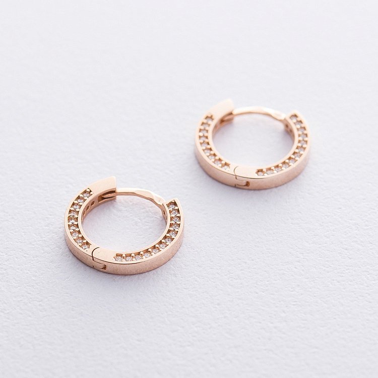 Золотые серьги - кольца с фианитами с06550 от ювелирного магазина Оникс