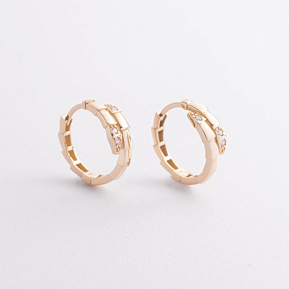 Сережки - кільця "Змії" у жовтому золоті (фіаніти) с09527