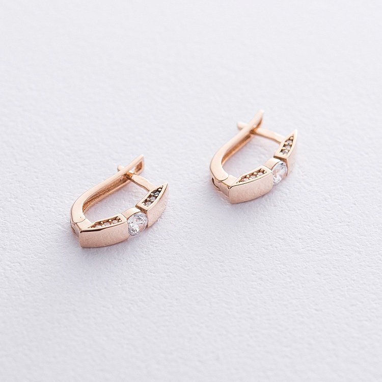 Золоті сережки з фіанітами с06591 від ювелірного магазину Онікс