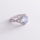Серебряное кольцо с голубым топазом и фианитами 111449 от ювелирного магазина Оникс