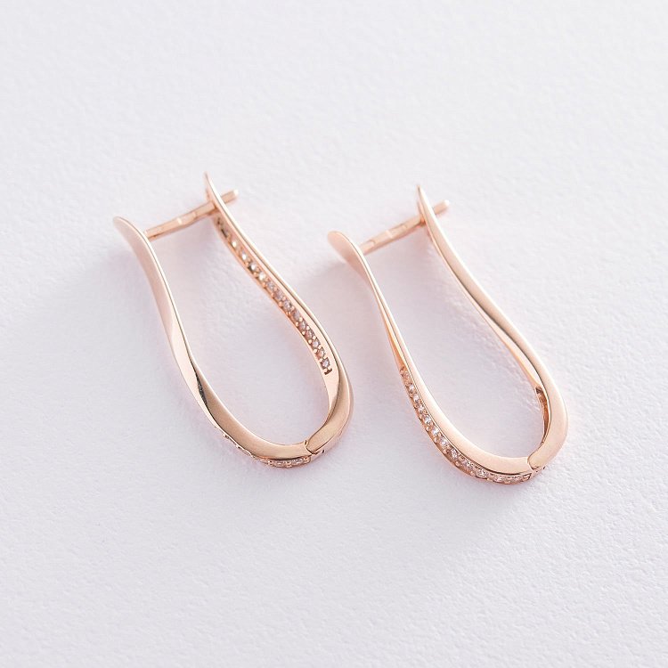 Золоті сережки з фіанітами с06717 від ювелірного магазину Онікс