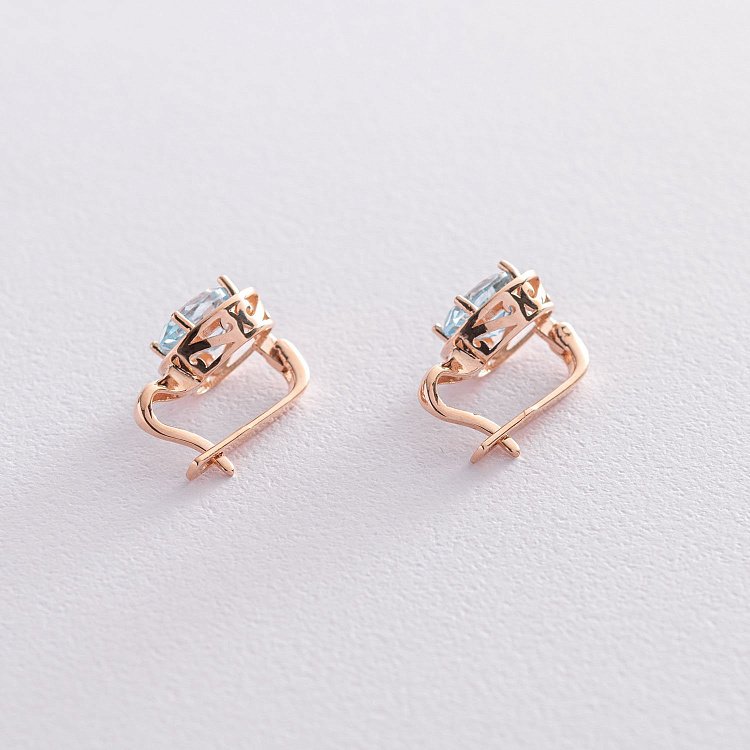 Золотые серьги с голубыми топазами с05463 от ювелирного магазина Оникс - 2