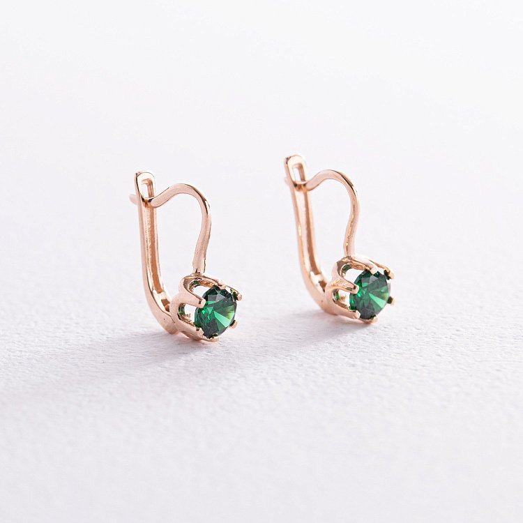 Дитячі золоті сережки з зеленими фіанітами с05762 від ювелірного магазину Онікс