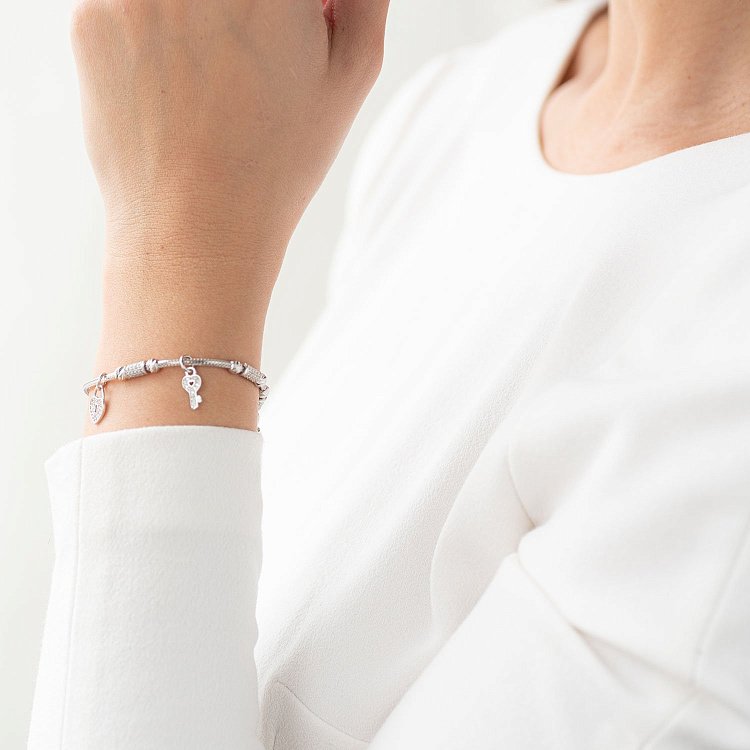 Золотий браслет "Сердечко з ключиком" (фіаніт) б04012 від ювелірного магазину Онікс - 1