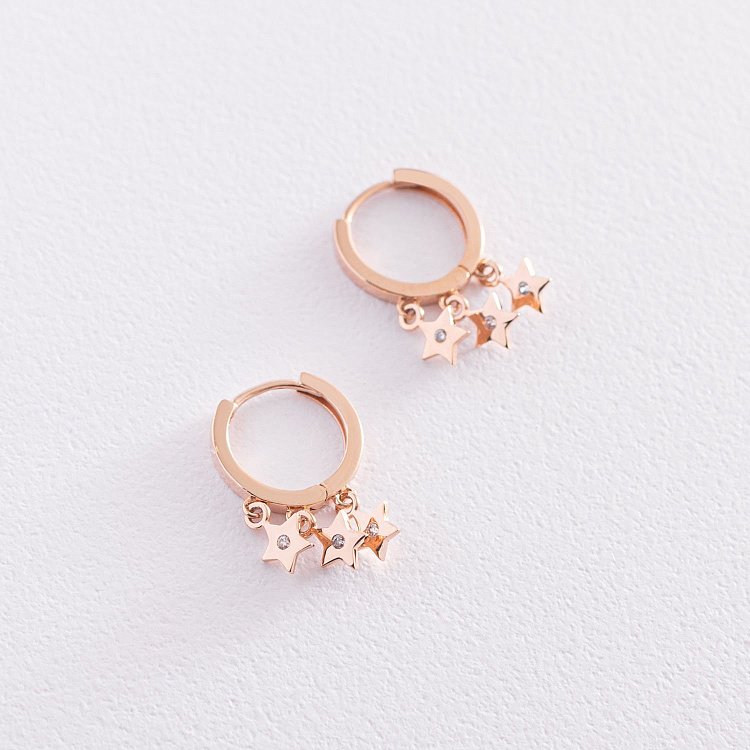 Золоті сережки - кільця "Зірочки" з фіанітами с07477 від ювелірного магазину Онікс