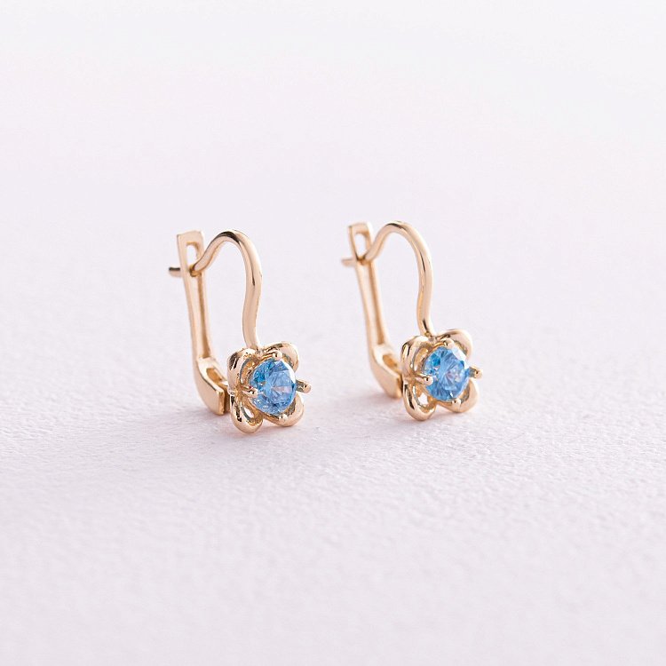 Детские золотые серьги "Цветочки" (голубые фианиты) с08064г от ювелирного магазина Оникс