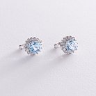Срібні сережки з блакитними топазами і фіанітами 121328 от ювелирного магазина Оникс