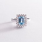 Серебряное кольцо с голубым топазом и фианитами 111448 от ювелирного магазина Оникс