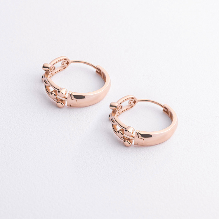 Серьги - кольца "Фантазия" в красном золоте с09586 от ювелирного магазина Оникс - 1