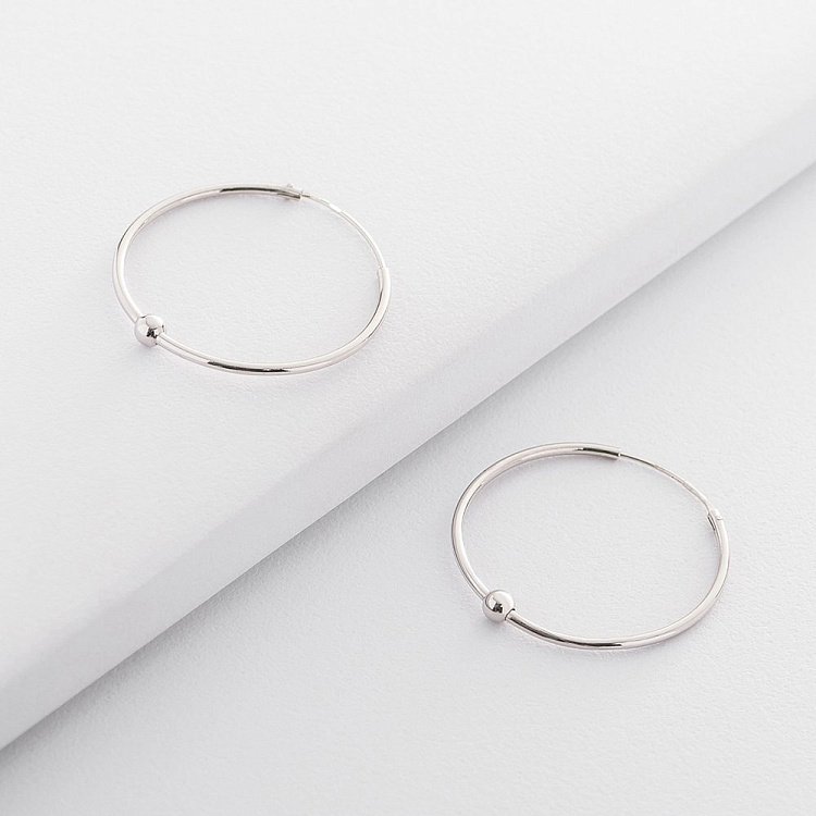 Срібні сережки-кільця 122443 від ювелірного магазину Онікс