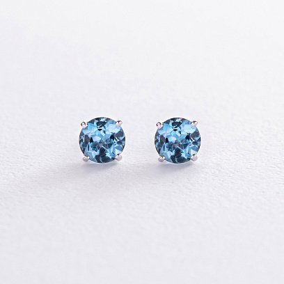 Золоті сережки - пусети з блакитними топазами с08410