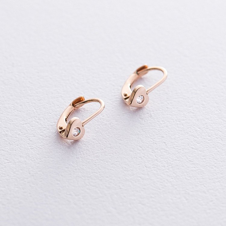 Золотые детские серьги "Сердечки" с фианитами с06086 от ювелирного магазина Оникс