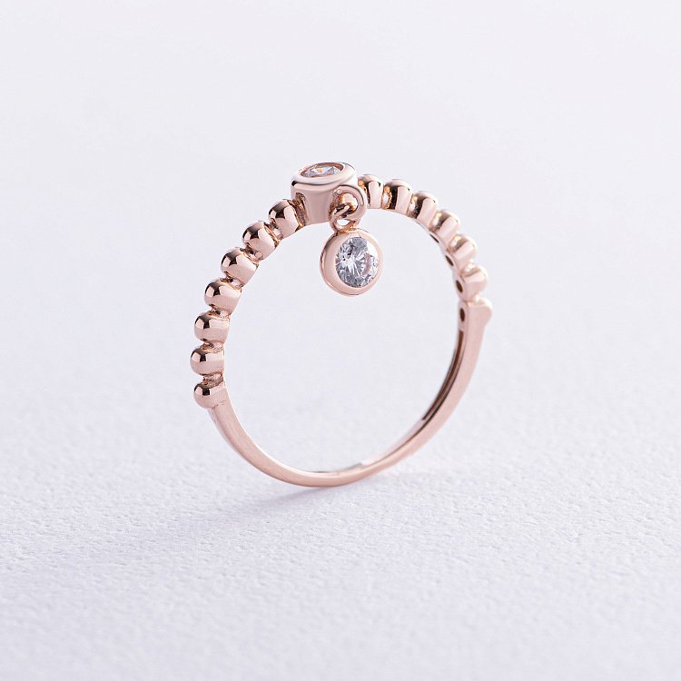 Золота каблучка з фіанітами к07050 Золота каблучка з фіанітами к07050 від ювелірного магазину Онікс