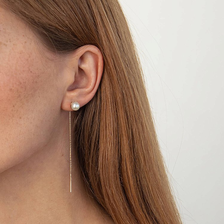 Золотые серьги - протяжки с жемчугом с07654 от ювелирного магазина Оникс