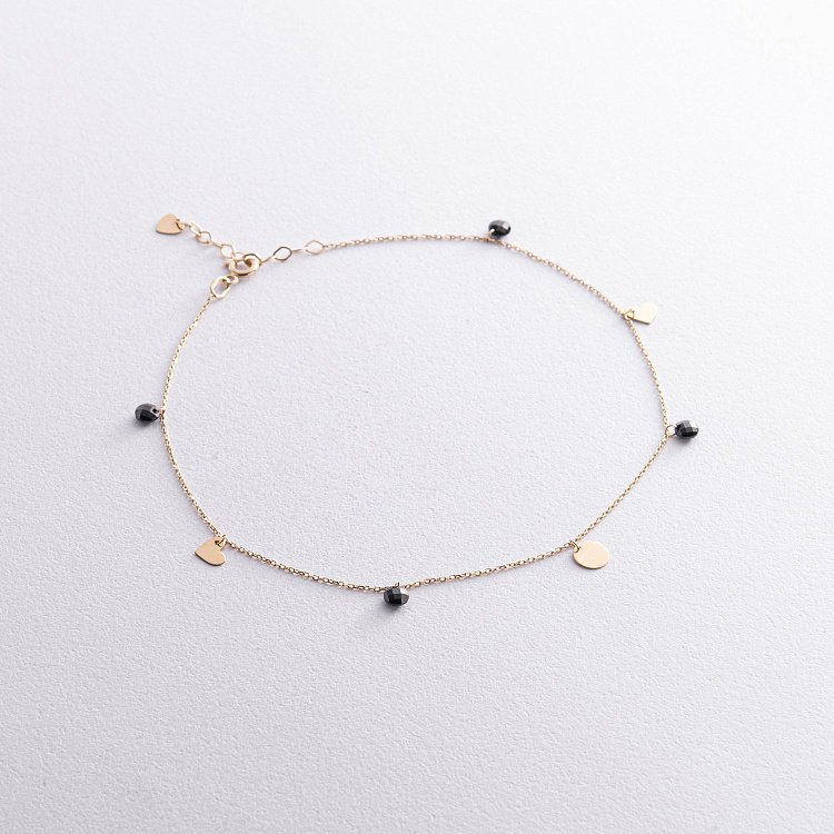 Золотий браслет "Сердечка і монетка" на ногу (чорні фіаніти) б04796 від ювелірного магазину Онікс