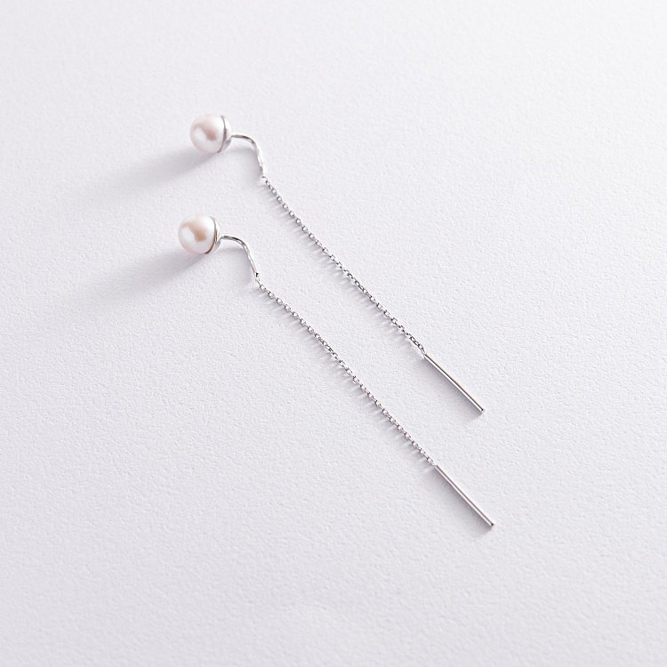 Золоті сережки - протяжки з перлами с07702 від ювелірного магазину Онікс