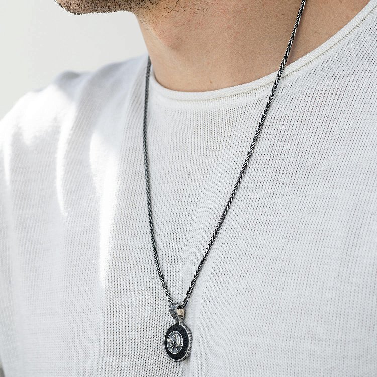 Срібний кулон "Знак зодіаку Тілець" з ебеном 1041телець - 1 Срібний кулон "Знак зодіаку Тілець" з ебеном 1041телець від ювелірного магазину Онікс - 1