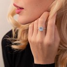 Серебряное кольцо с голубым топазом и фианитами 111474 от ювелирного магазина Оникс - 1