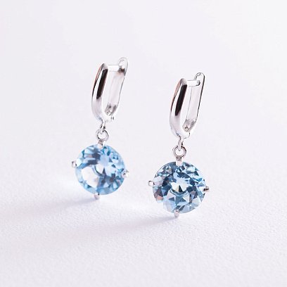 Золоті сережки "Захоплення" з блакитним топазом с05290