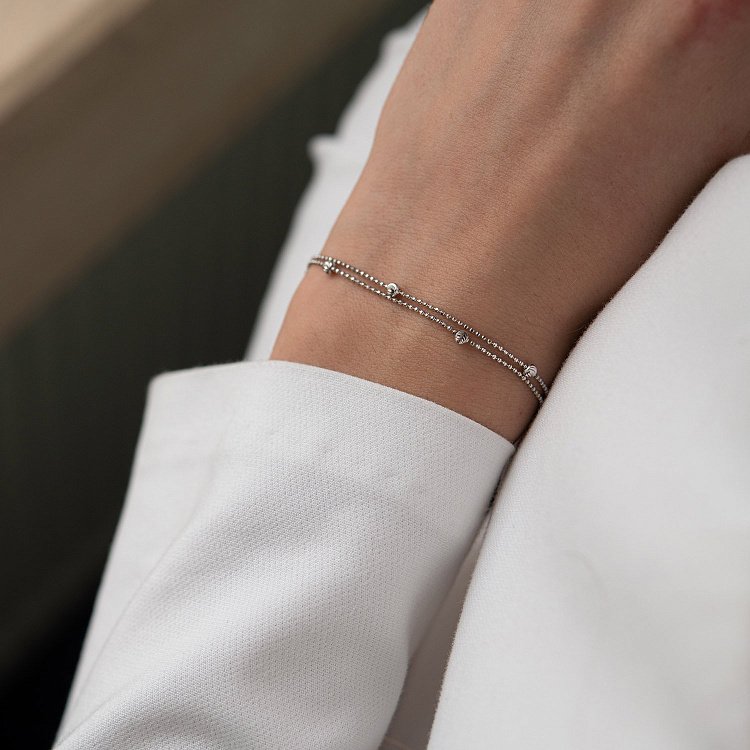 Подвійний браслет "Кульки" в білому золоті б04757 від ювелірного магазину Онікс - 1