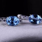 Жіночі сережки з блакитним топазом (фіаніти) 121384 от ювелирного магазина Оникс