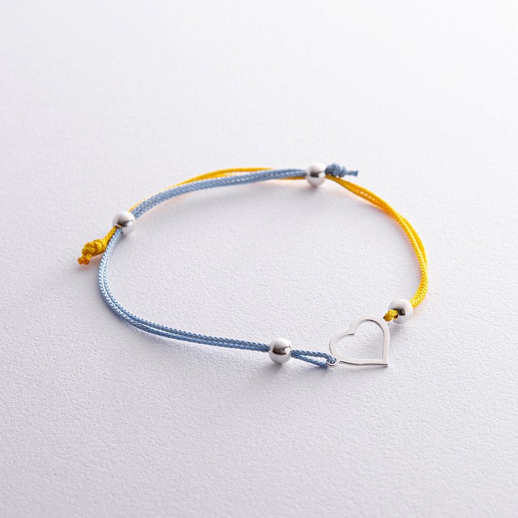 Срібний браслет "Українське серце" (блакитна та жовта нитка) 312/2 від ювелірного магазину Онікс - 1
