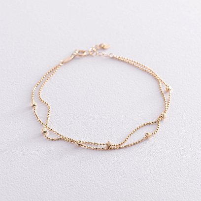 Подвійний браслет "Кульки" в жовтому золоті б04733