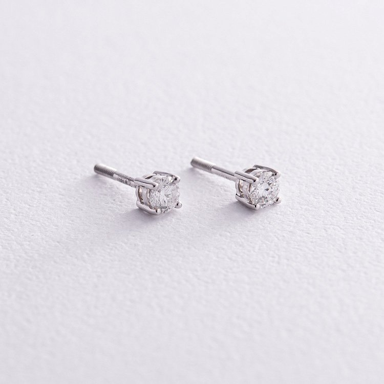 Золоті сережки - пусети з діамантами 331371121 від ювелірного магазину Онікс