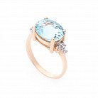 Золотое кольцо с голубым топазом и фианитами к03057 от ювелирного магазина Оникс