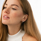 Сережки - кільця "Love" у білому золоті с09145 от ювелирного магазина Оникс - 1