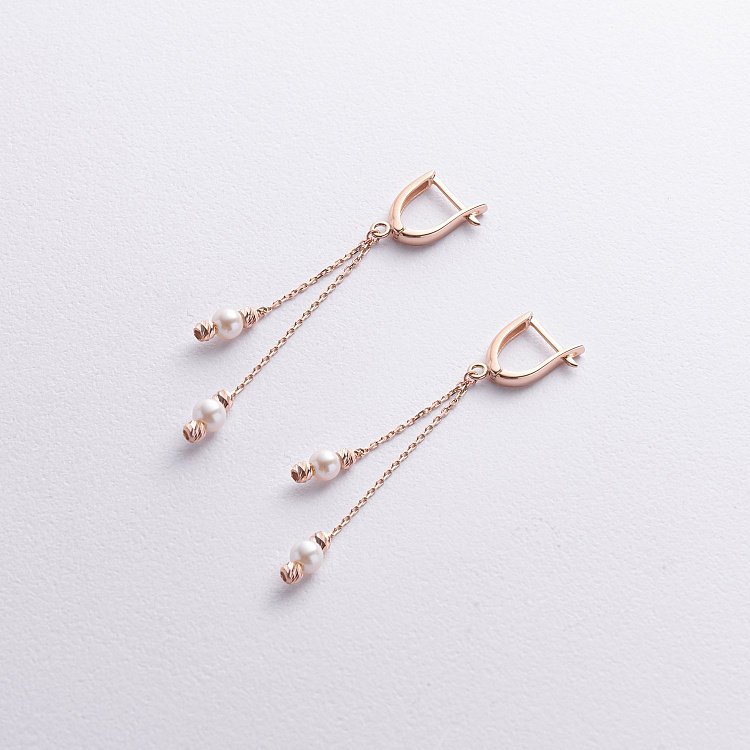 Золоті сережки з перлами на ланцюжку с07717 від ювелірного магазину Онікс - 1