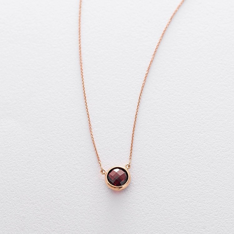 Золотое колье с пиропом кол01179 от ювелирного магазина Оникс