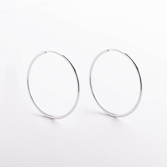 Серьги - кольца в белом золоте с09689