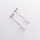 Срібні сережки - пусети з перлами на ланцюжку 2340/1р-3PWT от ювелирного магазина Оникс