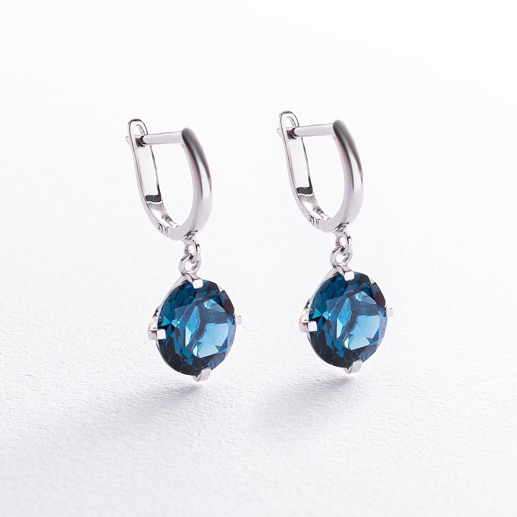 Золотые серьги "Влечение" с синтетическим топазом Лондон с05285 от ювелирного магазина Оникс