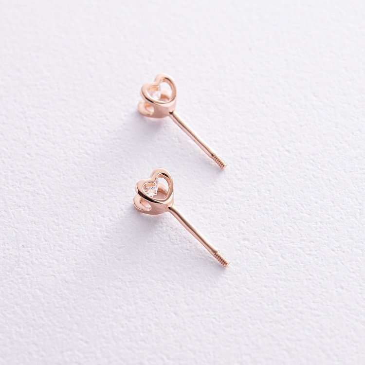 Золоті сережки - пусети "Сердечки" з фіанітами с08461 від ювелірного магазину Онікс