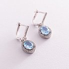 Срібні сережки з блакитними топазами і фіанітами 121355 от ювелирного магазина Оникс