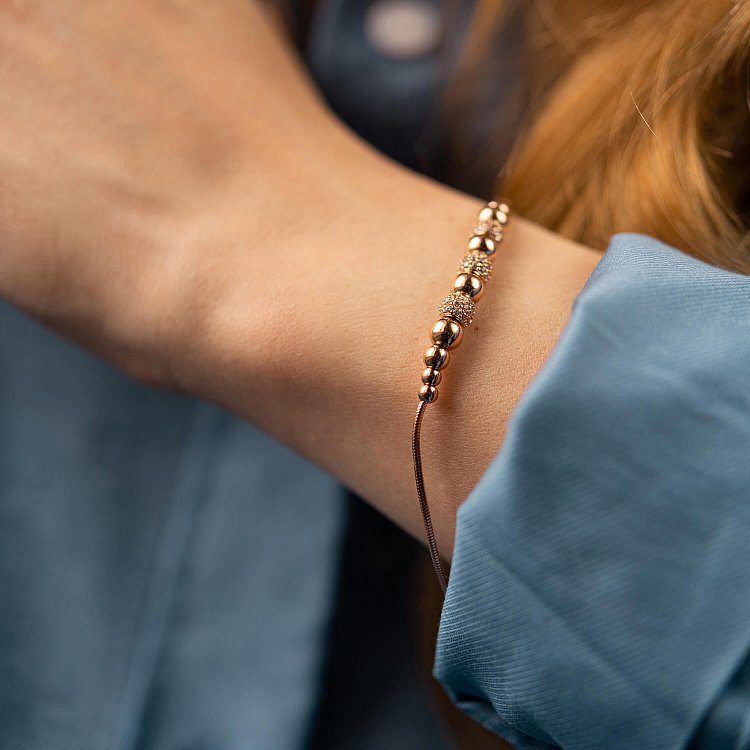 Браслет "Кульки" у червоному золоті (фіаніти) б04801 від ювелірного магазину Онікс - 1